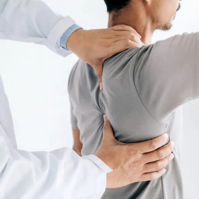 physiotherapist doing healing treatment man s back back pain patient treatment